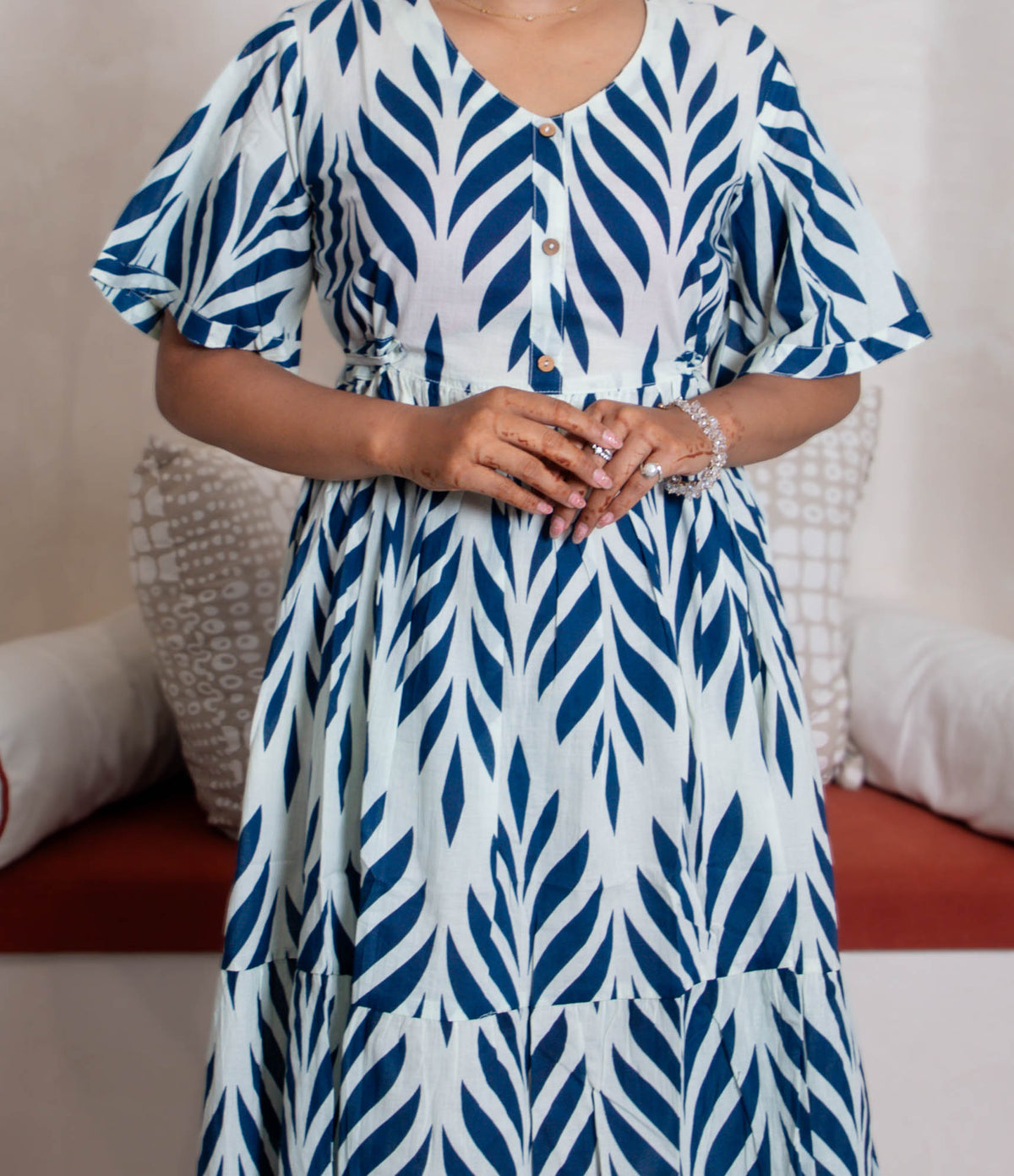 girl in blue branches dress close up