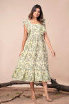 girl in yellow floral dress full view