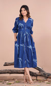 girl in indigo dress hands in pocket