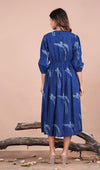 girl in indigo midi dress back view