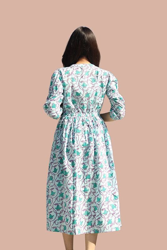 girl in floral blue dress back view