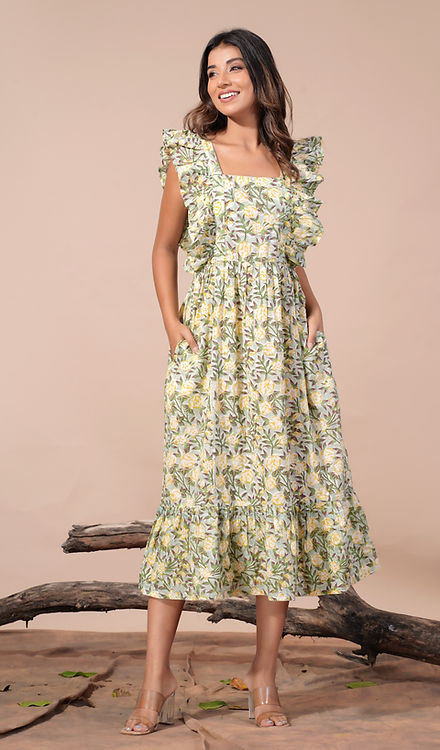 girl in yellow floral dress side view