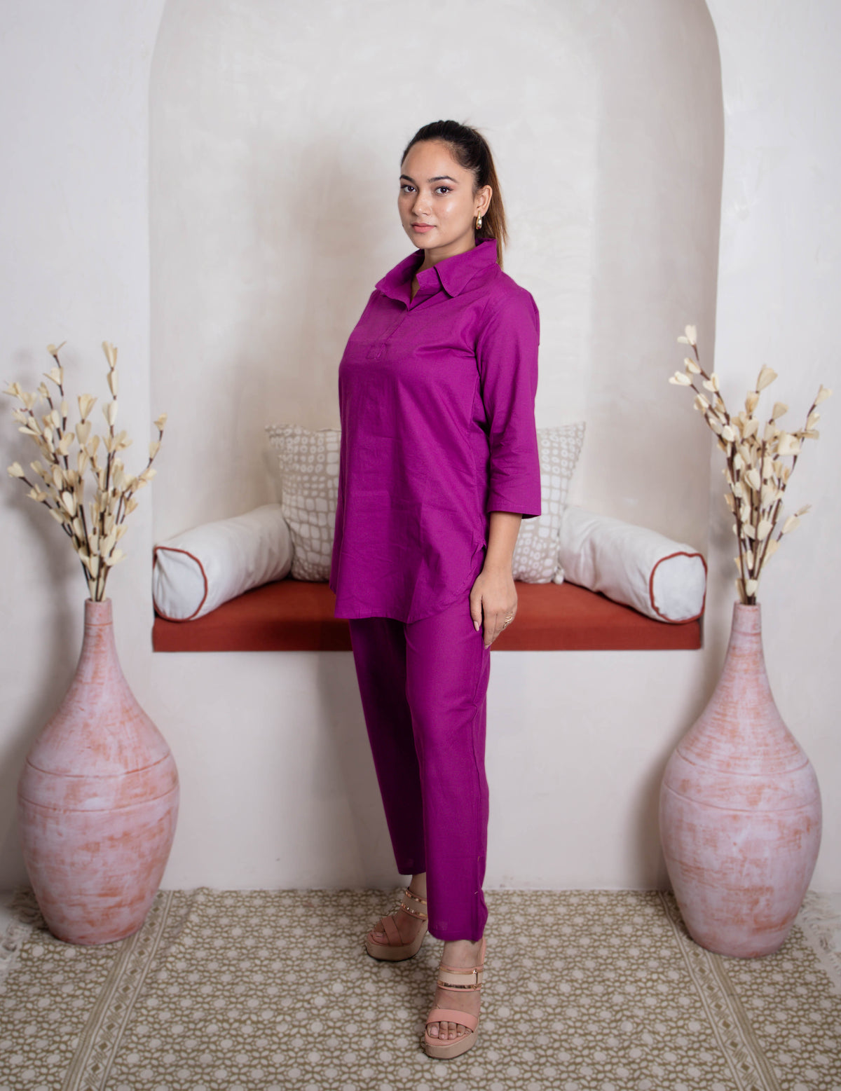 girl in plum coordset side view