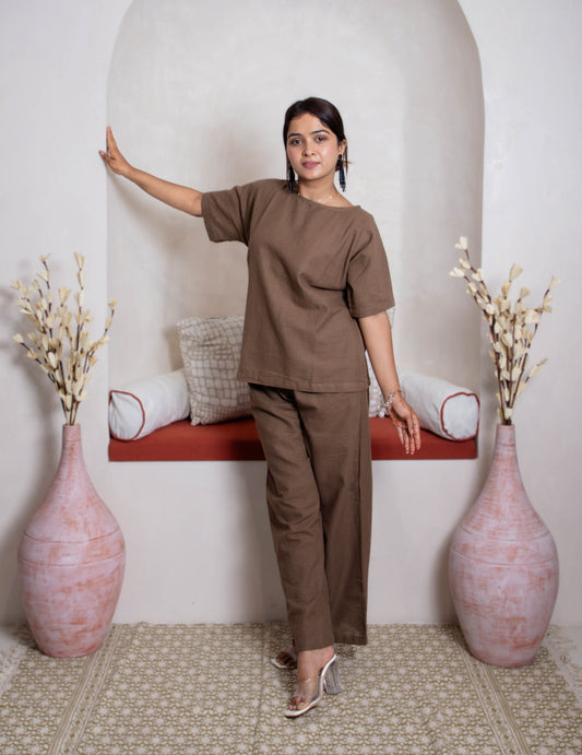 girl in  earthy coordset with vase