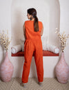 girl in rust coord set back view