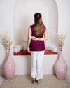 girl in maroon top back view