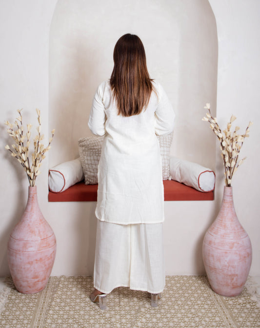 girl in white coord kurta back view