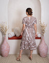 girl in brown dress back view