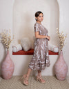 girl wearing brown white dress