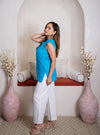 girl in blue top and white pants
