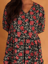 girl in red and black floral dress